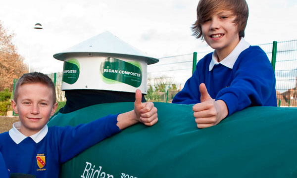 two school boys with Ridan composting machine