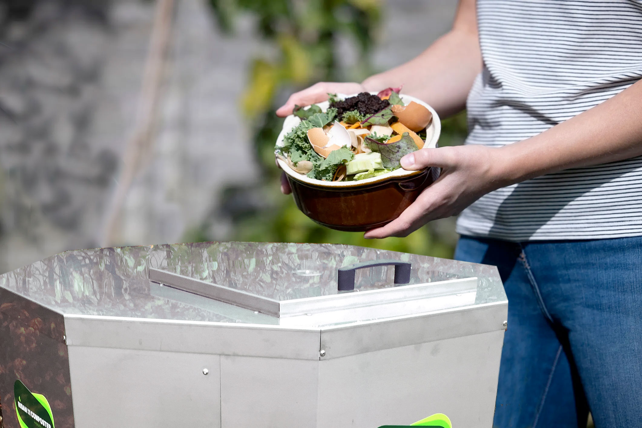 emptying food waste into Ridan composter