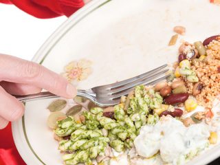 Food scraps being scrapped from plate